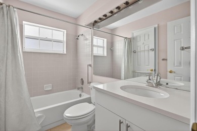 Welcome to this charming single-story home in the gated Barclay on PGA National Golf Club in Florida - for sale on GolfHomes.com, golf home, golf lot