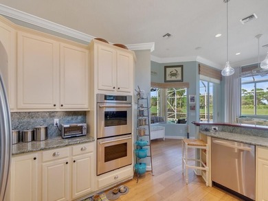 This pool home features a 2022 roof, laminate flooring on The Legacy Golf and Tennis Club in Florida - for sale on GolfHomes.com, golf home, golf lot