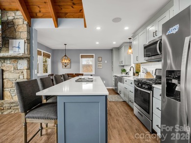 BIG VIEWS from this recently updated three-bedroom, two full on Rumbling Bald Resort on Lake Lure in North Carolina - for sale on GolfHomes.com, golf home, golf lot