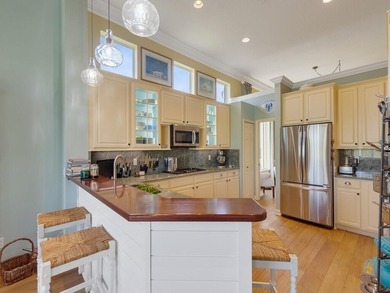 This pool home features a 2022 roof, laminate flooring on The Legacy Golf and Tennis Club in Florida - for sale on GolfHomes.com, golf home, golf lot