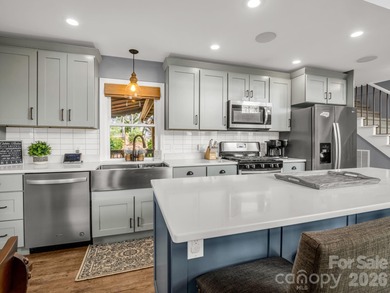 BIG VIEWS from this recently updated three-bedroom, two full on Rumbling Bald Resort on Lake Lure in North Carolina - for sale on GolfHomes.com, golf home, golf lot