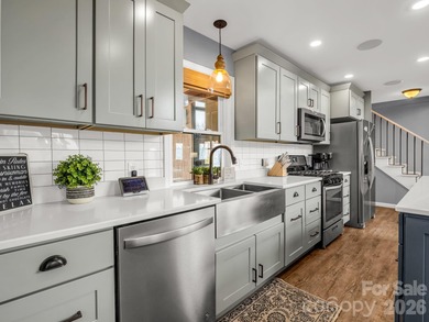 BIG VIEWS from this recently updated three-bedroom, two full on Rumbling Bald Resort on Lake Lure in North Carolina - for sale on GolfHomes.com, golf home, golf lot