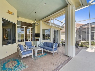 This pool home features a 2022 roof, laminate flooring on The Legacy Golf and Tennis Club in Florida - for sale on GolfHomes.com, golf home, golf lot