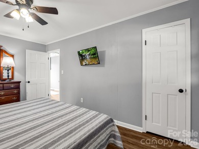 BIG VIEWS from this recently updated three-bedroom, two full on Rumbling Bald Resort on Lake Lure in North Carolina - for sale on GolfHomes.com, golf home, golf lot