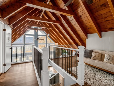 BIG VIEWS from this recently updated three-bedroom, two full on Rumbling Bald Resort on Lake Lure in North Carolina - for sale on GolfHomes.com, golf home, golf lot