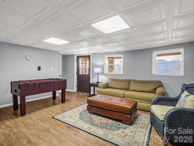 BIG VIEWS from this recently updated three-bedroom, two full on Rumbling Bald Resort on Lake Lure in North Carolina - for sale on GolfHomes.com, golf home, golf lot