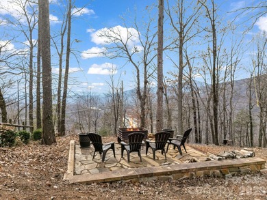 BIG VIEWS from this recently updated three-bedroom, two full on Rumbling Bald Resort on Lake Lure in North Carolina - for sale on GolfHomes.com, golf home, golf lot