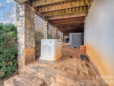 BIG VIEWS from this recently updated three-bedroom, two full on Rumbling Bald Resort on Lake Lure in North Carolina - for sale on GolfHomes.com, golf home, golf lot