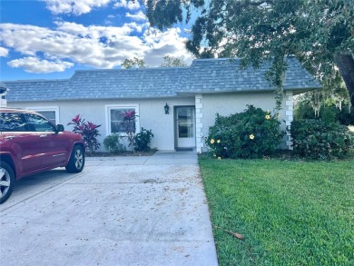 This spacious CORNER Unit located on the 14th Hole of Seven on Seven Springs Golf and Country Club in Florida - for sale on GolfHomes.com, golf home, golf lot