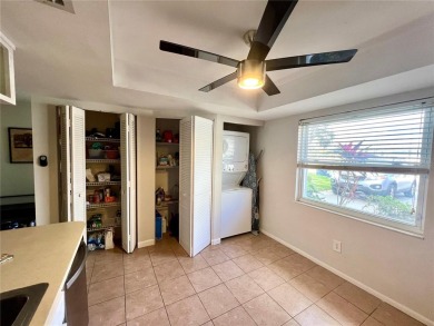 This spacious CORNER Unit located on the 14th Hole of Seven on Seven Springs Golf and Country Club in Florida - for sale on GolfHomes.com, golf home, golf lot