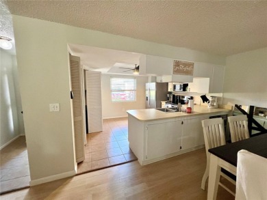 This spacious CORNER Unit located on the 14th Hole of Seven on Seven Springs Golf and Country Club in Florida - for sale on GolfHomes.com, golf home, golf lot