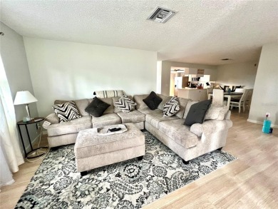 This spacious CORNER Unit located on the 14th Hole of Seven on Seven Springs Golf and Country Club in Florida - for sale on GolfHomes.com, golf home, golf lot