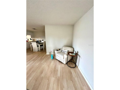 This spacious CORNER Unit located on the 14th Hole of Seven on Seven Springs Golf and Country Club in Florida - for sale on GolfHomes.com, golf home, golf lot