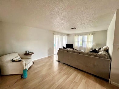 This spacious CORNER Unit located on the 14th Hole of Seven on Seven Springs Golf and Country Club in Florida - for sale on GolfHomes.com, golf home, golf lot