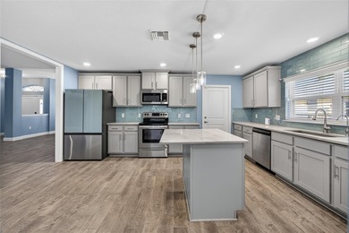 DEEP CREEK! Updated 4-bedroom, 3-bath, oversized 2-car garage on Deep Creek Golf Club in Florida - for sale on GolfHomes.com, golf home, golf lot