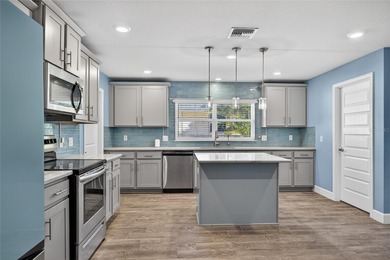 DEEP CREEK! Updated 4-bedroom, 3-bath, oversized 2-car garage on Deep Creek Golf Club in Florida - for sale on GolfHomes.com, golf home, golf lot