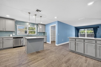 DEEP CREEK! Updated 4-bedroom, 3-bath, oversized 2-car garage on Deep Creek Golf Club in Florida - for sale on GolfHomes.com, golf home, golf lot