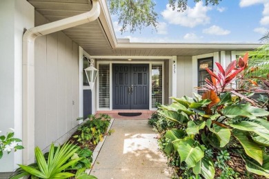 Discover this beautifully updated, move-in-ready pool home on East Lake Woodlands Country Club in Florida - for sale on GolfHomes.com, golf home, golf lot