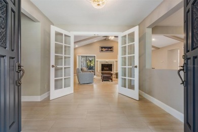 Discover this beautifully updated, move-in-ready pool home on East Lake Woodlands Country Club in Florida - for sale on GolfHomes.com, golf home, golf lot