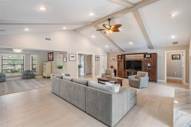 Discover this beautifully updated, move-in-ready pool home on East Lake Woodlands Country Club in Florida - for sale on GolfHomes.com, golf home, golf lot