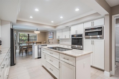 Discover this beautifully updated, move-in-ready pool home on East Lake Woodlands Country Club in Florida - for sale on GolfHomes.com, golf home, golf lot