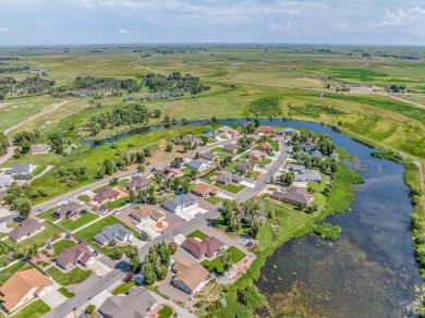 Nestled in the picturesque Cattails Golf Course community in on Cattails Golf Club in Colorado - for sale on GolfHomes.com, golf home, golf lot