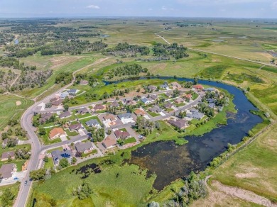 Nestled in the picturesque Cattails Golf Course community in on Cattails Golf Club in Colorado - for sale on GolfHomes.com, golf home, golf lot