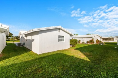 This Challenger model in desirable 55+ Palm Beach Leisureville on Leisureville Community Golf Course in Florida - for sale on GolfHomes.com, golf home, golf lot