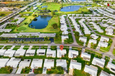 This Challenger model in desirable 55+ Palm Beach Leisureville on Leisureville Community Golf Course in Florida - for sale on GolfHomes.com, golf home, golf lot