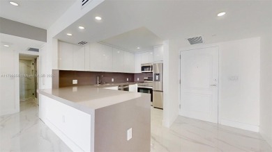 Enjoy breathtaking panoramic views from this beautifully on Turnberry Isle Resort and Club in Florida - for sale on GolfHomes.com, golf home, golf lot
