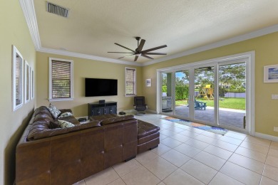 Welcome to this stunning estate home nestled within a premier on Hammock Creek Golf Club in Florida - for sale on GolfHomes.com, golf home, golf lot