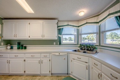 This beautiful 2-bedroom, 2-bathroom home is located in the on Lake Fairways Country Club in Florida - for sale on GolfHomes.com, golf home, golf lot