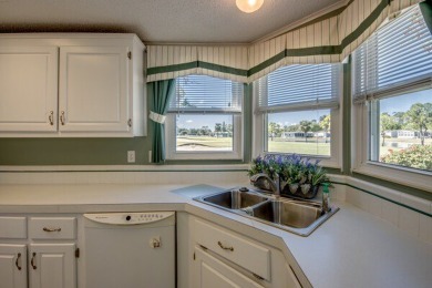 This beautiful 2-bedroom, 2-bathroom home is located in the on Lake Fairways Country Club in Florida - for sale on GolfHomes.com, golf home, golf lot