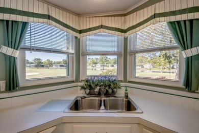This beautiful 2-bedroom, 2-bathroom home is located in the on Lake Fairways Country Club in Florida - for sale on GolfHomes.com, golf home, golf lot