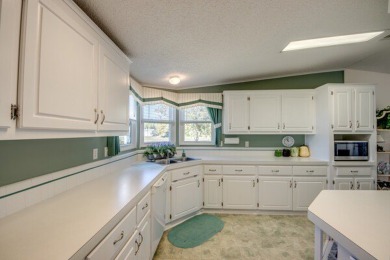 This beautiful 2-bedroom, 2-bathroom home is located in the on Lake Fairways Country Club in Florida - for sale on GolfHomes.com, golf home, golf lot