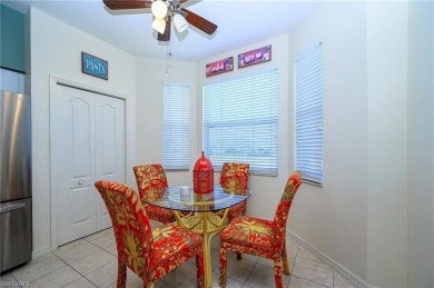 Panoramic lake and fairway views abound in this elegant on Cedar Hammock Golf and Country Club in Florida - for sale on GolfHomes.com, golf home, golf lot