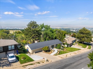 This beautiful home is perched high on the east bench of on Bountiful Ridge Golf Course in Utah - for sale on GolfHomes.com, golf home, golf lot