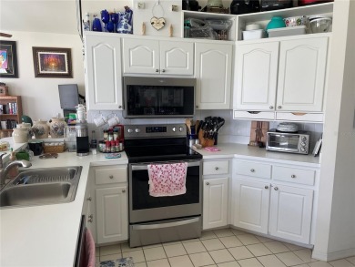 This charming 2-bedroom, 2-bath home is situated in the on Twisted Oaks Golf Club in Florida - for sale on GolfHomes.com, golf home, golf lot
