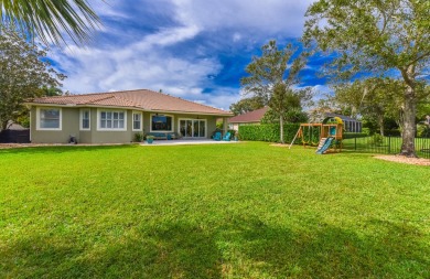 Welcome to this stunning estate home nestled within a premier on Hammock Creek Golf Club in Florida - for sale on GolfHomes.com, golf home, golf lot