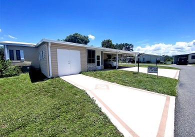 A corner lot home in a well-maintained, professionally managed on Lakes at Leesburg Golf Course in Florida - for sale on GolfHomes.com, golf home, golf lot