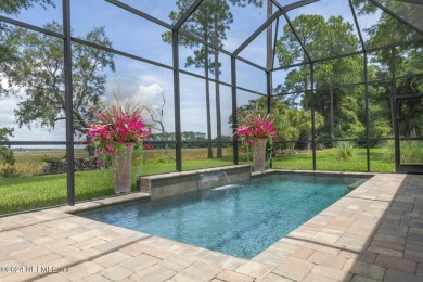 LUXURY LIFESTYLE! Indulge in a captivating pool home centrally on Golf Club At North Hampton in Florida - for sale on GolfHomes.com, golf home, golf lot