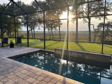 LUXURY LIFESTYLE! Indulge in a captivating pool home centrally on Golf Club At North Hampton in Florida - for sale on GolfHomes.com, golf home, golf lot