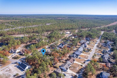 Welcome to this charming 3 bedroom, 2 bath one story ranch home on The Lakes Country Club in North Carolina - for sale on GolfHomes.com, golf home, golf lot