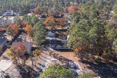 Welcome to this charming 3 bedroom, 2 bath one story ranch home on The Lakes Country Club in North Carolina - for sale on GolfHomes.com, golf home, golf lot