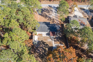 Welcome to this charming 3 bedroom, 2 bath one story ranch home on The Lakes Country Club in North Carolina - for sale on GolfHomes.com, golf home, golf lot