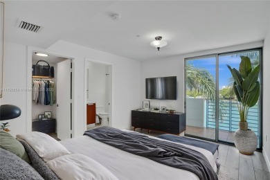 MOTIVATED SELLER!! Rare Bayfront Townhome with 30ft Boat Dock in on Normandy Shores Golf Course in Florida - for sale on GolfHomes.com, golf home, golf lot