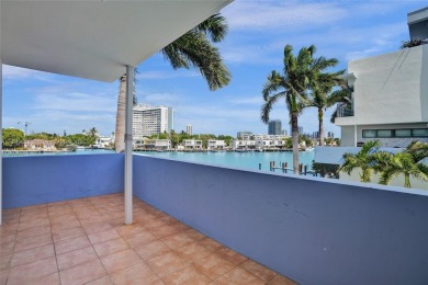 MOTIVATED SELLER!! Rare Bayfront Townhome with 30ft Boat Dock in on Normandy Shores Golf Course in Florida - for sale on GolfHomes.com, golf home, golf lot