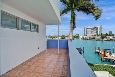 MOTIVATED SELLER!! Rare Bayfront Townhome with 30ft Boat Dock in on Normandy Shores Golf Course in Florida - for sale on GolfHomes.com, golf home, golf lot