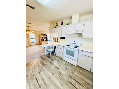 Welcome to this beautiful 2-bedroom, 2-bathroom home nestled in on Pine Lakes Country Club in Florida - for sale on GolfHomes.com, golf home, golf lot