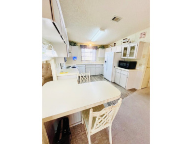 Welcome to this beautiful 2-bedroom, 2-bathroom home nestled in on Pine Lakes Country Club in Florida - for sale on GolfHomes.com, golf home, golf lot